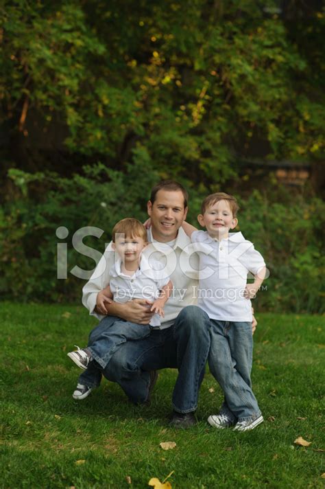 Father With His Sons Outside Stock Photo Royalty Free Freeimages