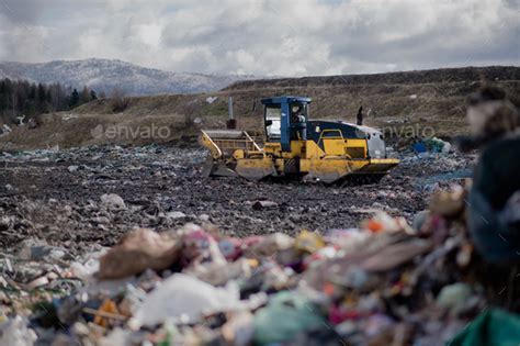 Garbage Truck Unloading Waste On Landfill Environmental Concept Stock