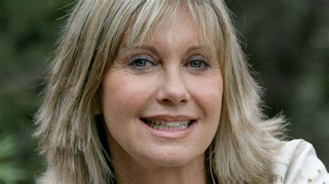olivia newton john says she s great after reports claim she s dying