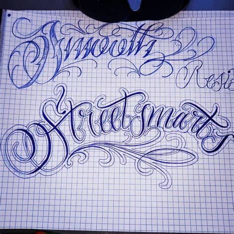 Some Type Of Lettering That Is On Top Of A Sheet Of Paper With Marker Pens