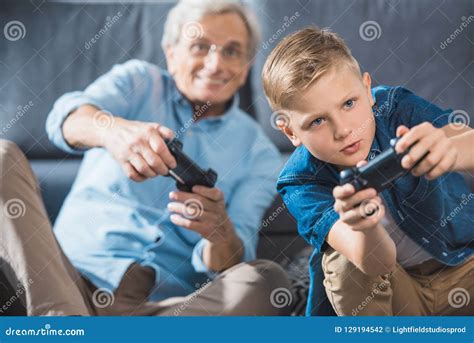 Grandfather And Grandson Playing Video Game Stock Photo Image Of