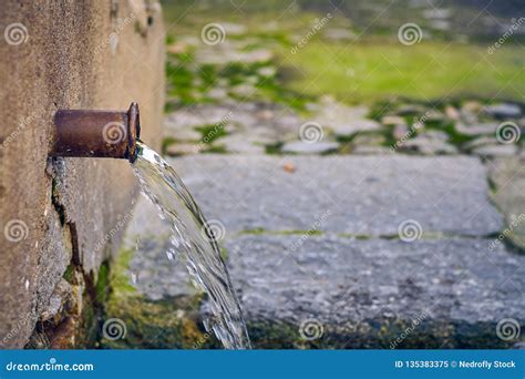 Natural Water Source With A Single Water Pipe Stock Image Image Of