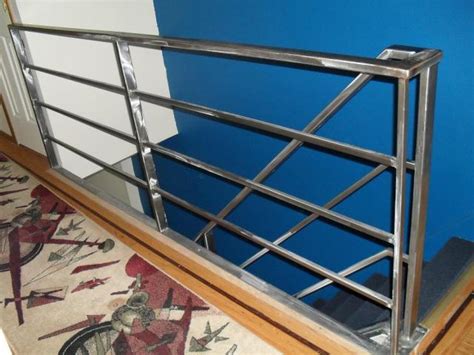 Single slope concrete parapets with chain link fence, vertical face concrete parapets with tubular steel railings Fabricator NY - Pipe Tubular Steel Hand Railing & Stair Railings