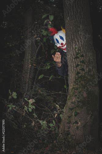 Scary Clown Behind Tree Stock Photo And Royalty Free Images On