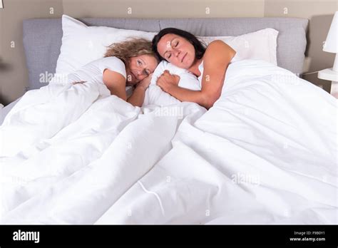 Two Attractive Women Hugging Each Other In Bed Stock Photo Alamy