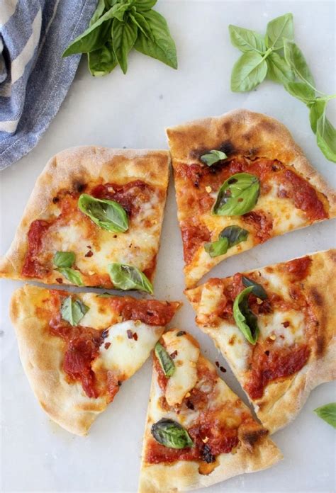 Make a simple pizza base, then top with tomato pizza sauce and mozzarella. Easy Pizza Margherita Recipe Video • CiaoFlorentina