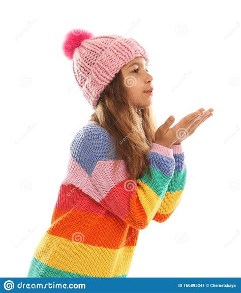 Cute Little Girl In Warm Clothes On Background Winter