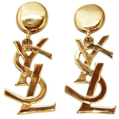 Yves saint laurent's original logo, boasting the sweeping ysl, was crafted by graphic artist cassandre in 1961 and promptly became one of the most memorable and untouchable symbols in. Highly Collectable YSL Logo Earrings of the 80s at 1stdibs