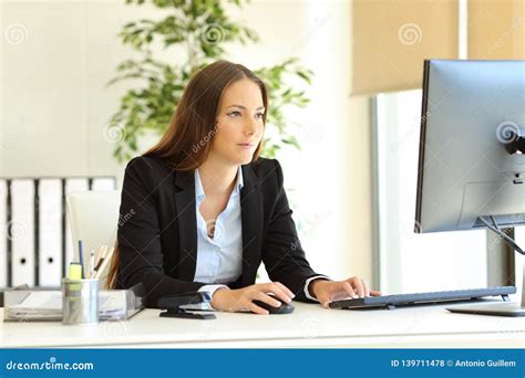 Serious Office Worker Works Using Computer Stock Photo Image Of Busy