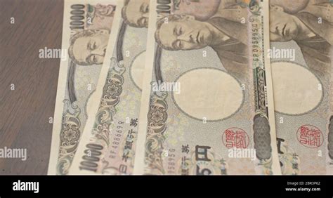 Counting Japanese Yen Banknote Stock Photo Alamy