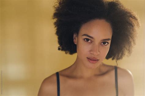 portrait of beautiful mixed race woman with afro hairstyle by stocksy contributor brkati