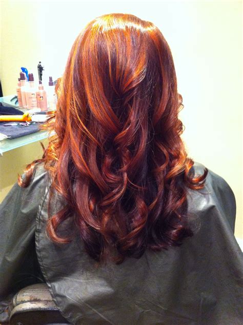 The perfect balance of red and brown tones, this auburn hair color is a solid choice for brunettes looking to add a little. Hair by AprilNadeau. Auburn with copper highlights over ...