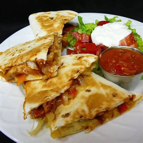 This chicken quesadilla recipe stuffed with monterey jack and cheddar cheese is just the appetizer for a cinco de mayo party or any celebration coming up. Barbecue Chicken Quesadillas recipe - All recipes Australia NZ
