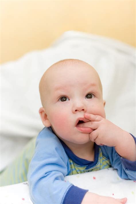 Baby On Bed Put Fingers In Mouth Stock Photo Image Of Looking