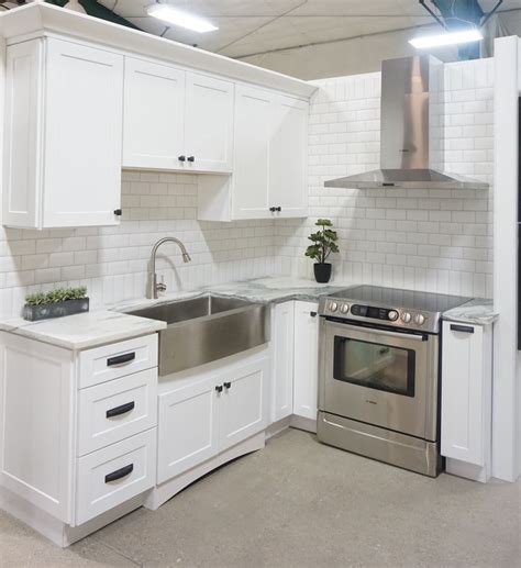 Maybe you would like to learn more about one of these? White cabinets, shaker door style, white marble ...