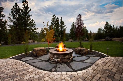 Whether you are looking for portable fire pit ideas that you can move around your patio or something more sophisticated that will be your central many popular backyard designs include terracotta, metal or ceramic planters surrounding the edges of the fire pit area. 24 Brick Fire Pits And The Homes And Gardens That Surround ...