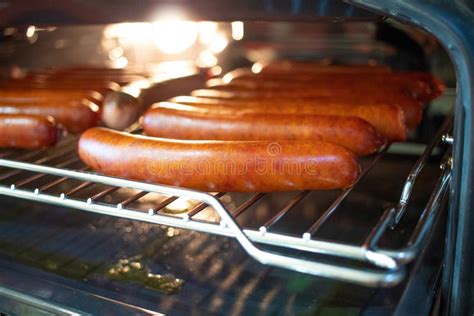 Cooking Sausages In The Oven Fast Food Street Fried Sausages Stock