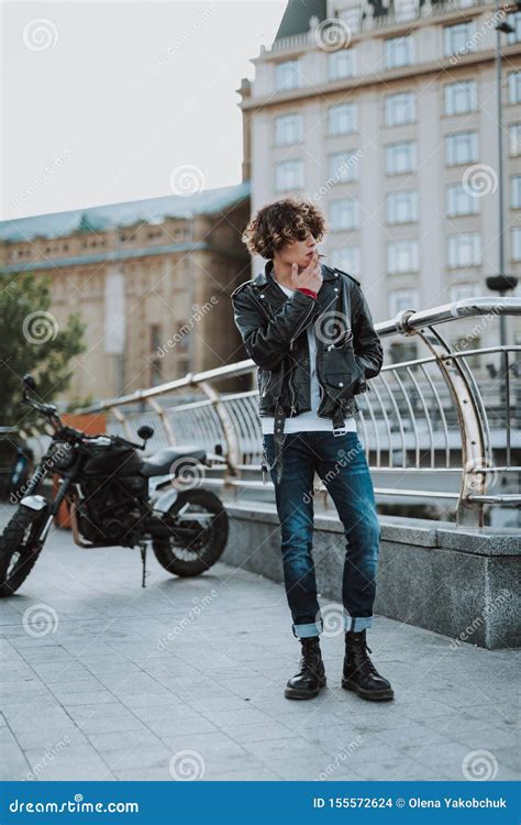 Young Biker Smoking Cigarette In The Street Stock Photo Image Of