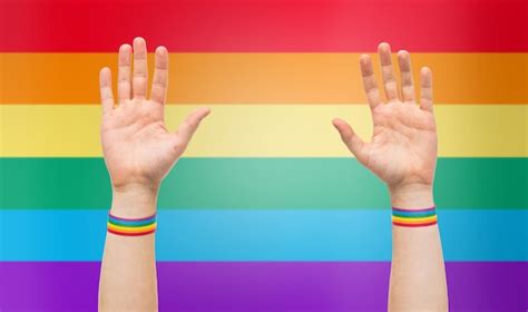 premium photo hands with gay pride rainbow wristbands