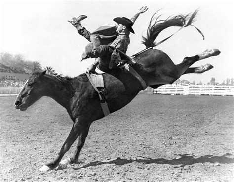 Riding A Bucking Bronco Photograph By Underwood Archives