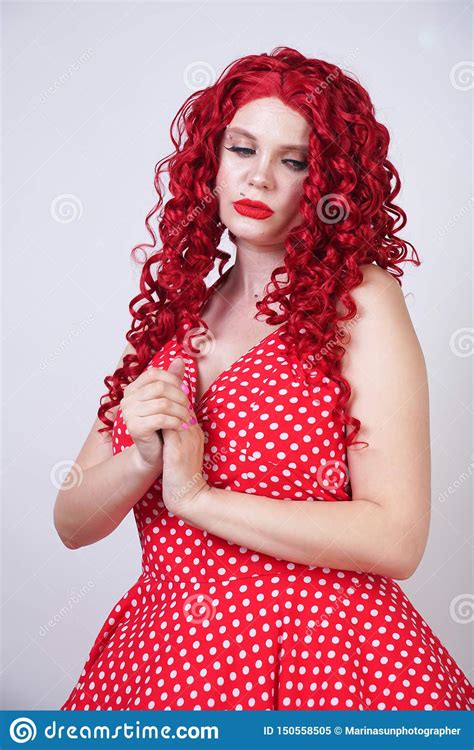 Plus Size Red Hair Curly Woman With Curvy Body Wearing Retro Polka Dot
