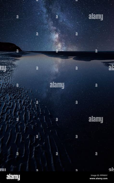 Stunning Vibrant Milky Way Composite Image Over Landscape Of Low Tide