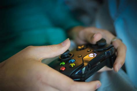 Person Holding Black Xbox Controller · Free Stock Photo