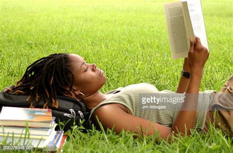 Black Woman Laying In Grass Photos And Premium High Res Pictures