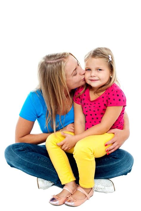 Beautiful Mom Kissing Her Pretty Daughter Royalty Free Stock