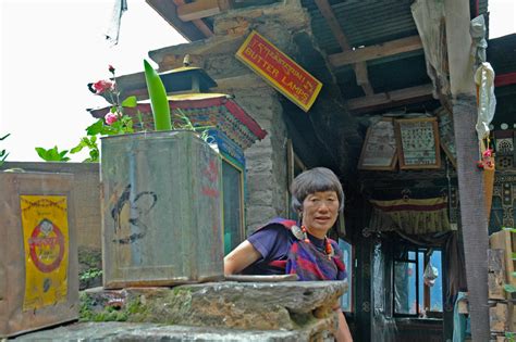 bhutan woman at her home sweet breathing deepening into a simple life
