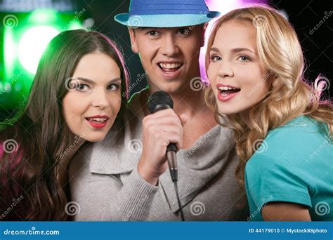 Group Of Three Friends Singing With Microphone Stock Photo Image Of