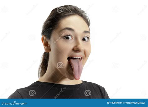 Smiling Girl Opening Her Mouth And Showing The Long Big Giant Tongue Isolated On White