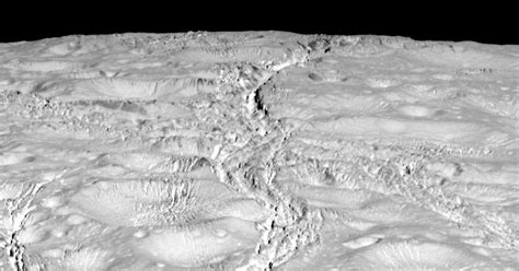 Nasa Photos Zoom In On Saturns Cracked Cratered Moon Cbs News