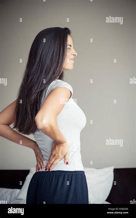 Woman Suffering From Back Pain Stock Photo Alamy