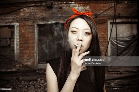 Young Asian Lady Smoking High Res Stock Photo Getty Images