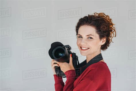 Professional Female Photographer With Digital Photo Camera In Photo