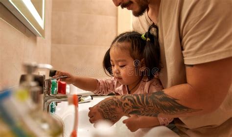 Asian Girl Closing Water In Wash Basin Near Father Stock Image Image