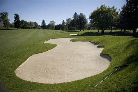 How to Rake Sand Bunkers on a Golf Course