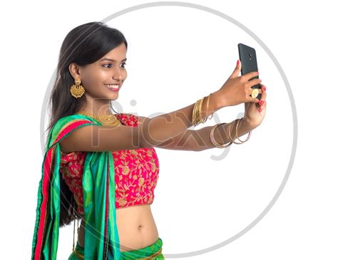 Image Of Portrait Of A Happy Young Traditional Indian Woman Taking