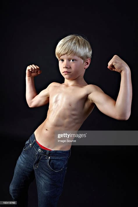 Boy Flexing Muscles High Res Stock Photo Getty Images