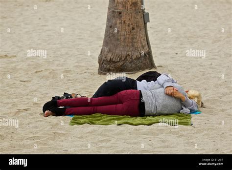 Morning After The Night Before Two Women Sleeping On The Beach At