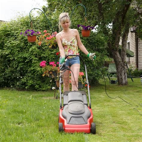 Women With Lawn Mower Stock Photo Colourbox