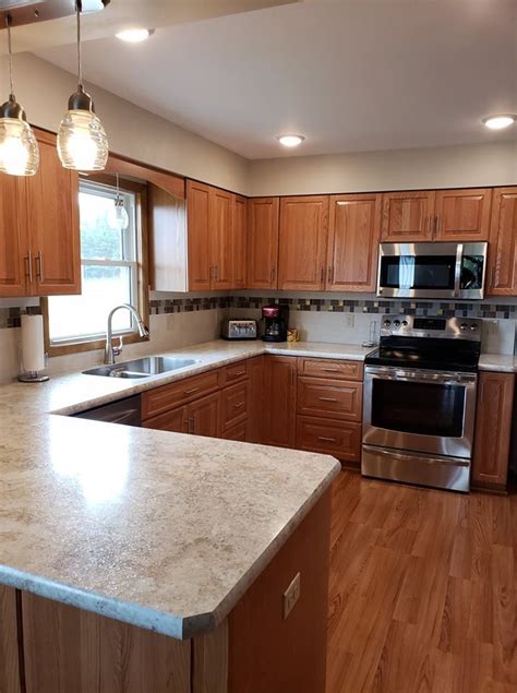 This kitchen received a total overhaul, including the cherry cabinets and island in this kitchen receive a fresh coat of paint in this renovation that cost. Traditional Kitchen Remodel with New Oak Cabinets ...