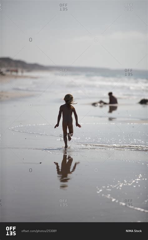 Silhouette Of Little Girl Running On The Beach Stock Photo Offset