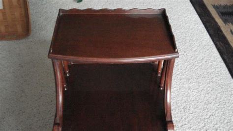 Found this table sitting outside with a free sign on it. Mersman step end table antique appraisal | InstAppraisal