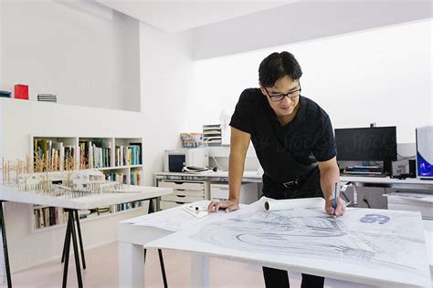 Handsome Asian Architect Working In Home Office By Stocksy