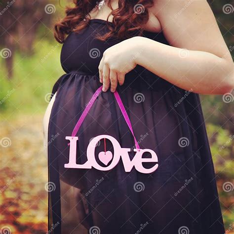 Beautiful Instagram Of Pregnant Woman Holding Quote Forest Path Stock