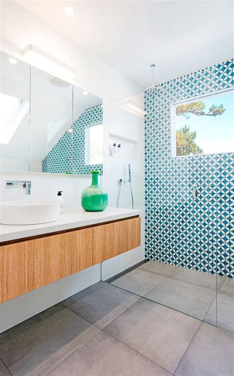 This White And Wood Bathroom Has A Bright Blue Accent Wall To Liven It