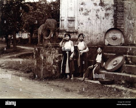 French Colonial Workers Resting Near A Temple Vietnam Photograph