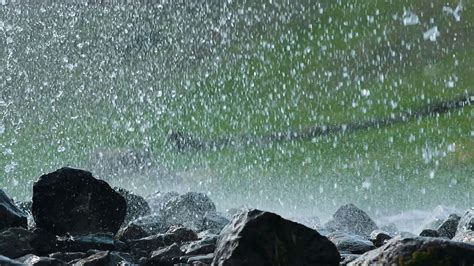 A heavy rain in nature. Wet big rocks Stock Video Footage - Storyblocks